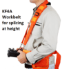 A man wearing a workbelt for holding a KF4A fusion splicer when working at height