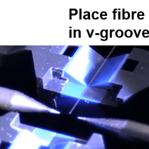 placing an optical fibre in the v-groove of a fusion splicer